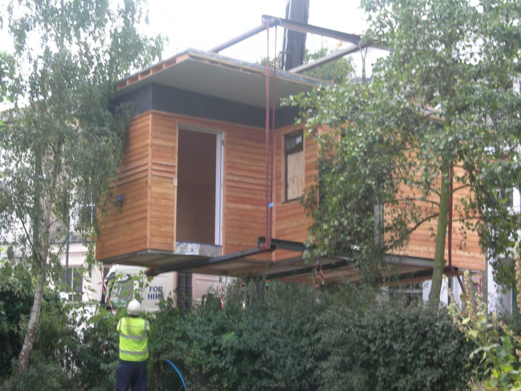 DSCN9568 prefabricated ecoshed being placed on site