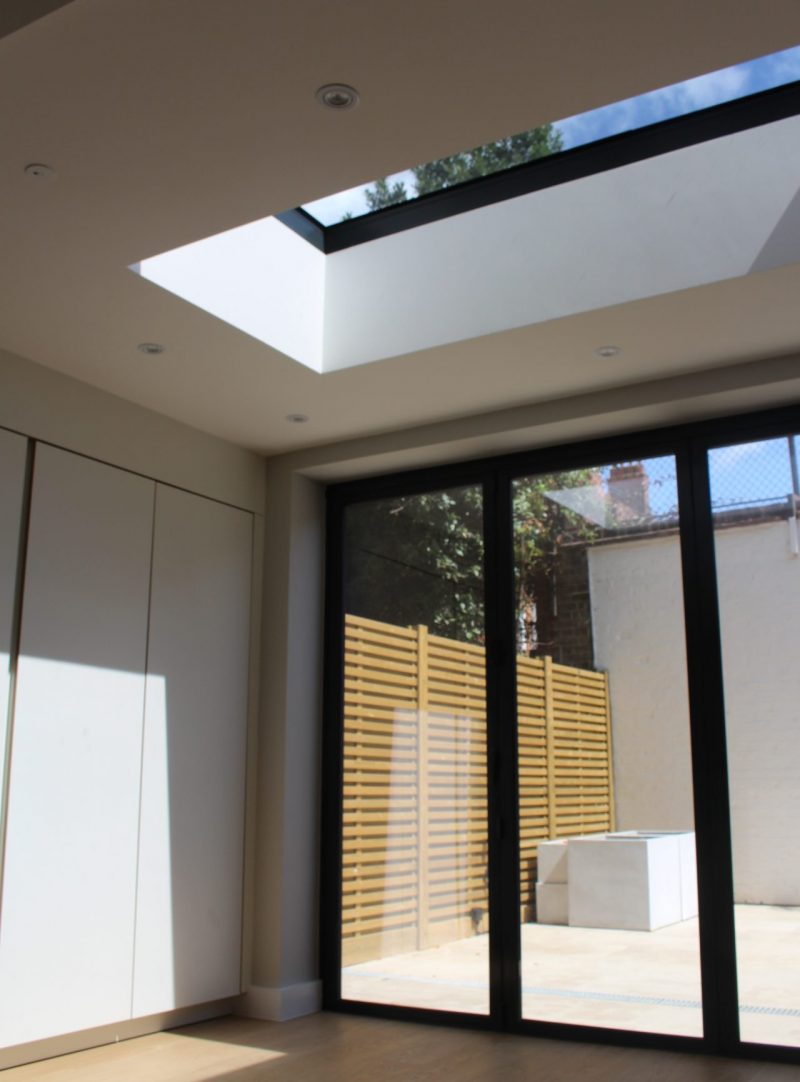 Internal view of Flat Rooflight looking outwards from Extension on Residential Project View of New Rooflight and Bifold Doors in Residential Extension