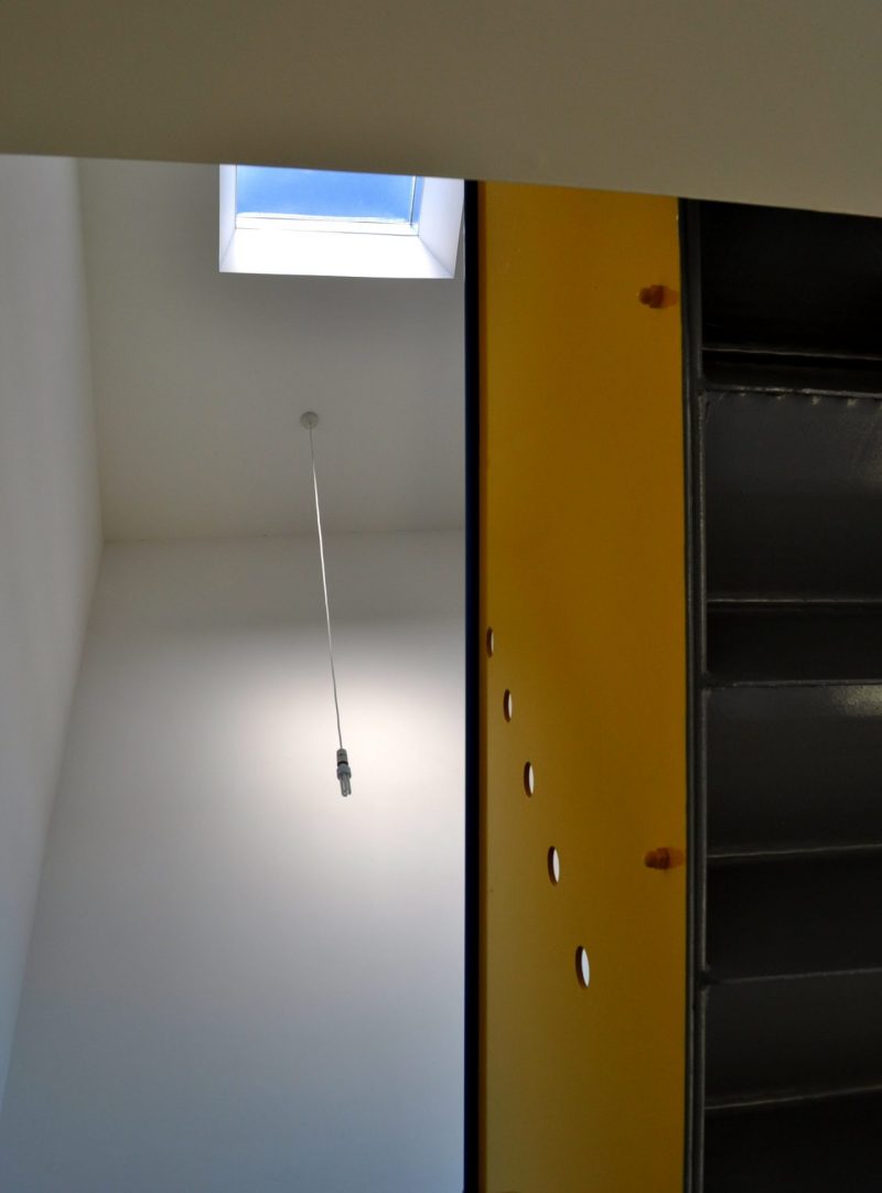 Interior photo showing metal balustrade and rooflight