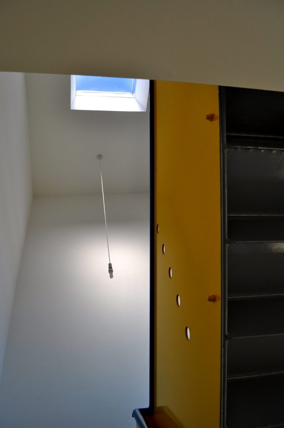 Interior photo showing metal balustrade and rooflight