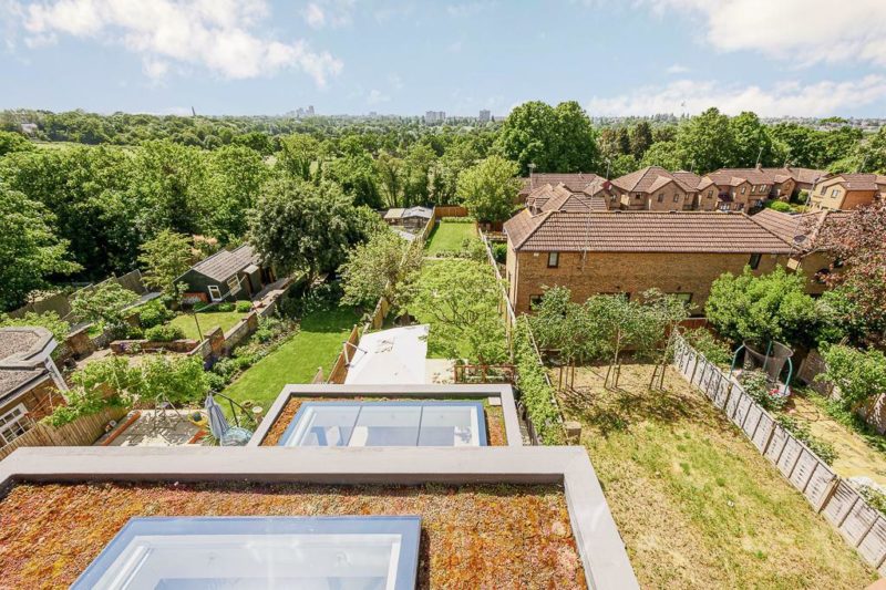 Ealing Extenison Project Green roof with skylights overlooking a garden and city views in London extension project in Ealing
